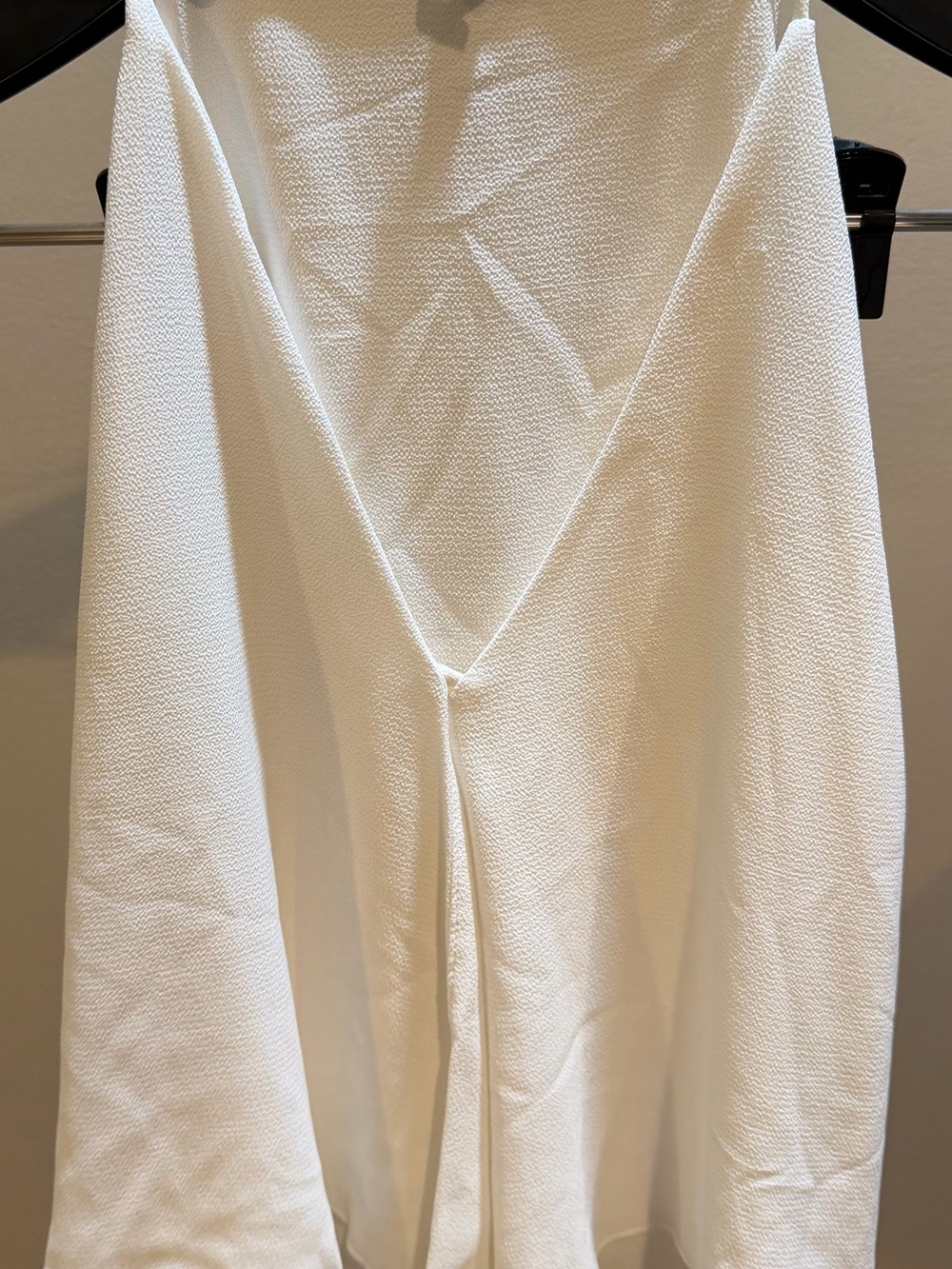 Tyche Cream Labeled Garment with Black Text